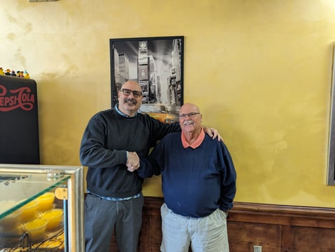 Certified Restaurant Broker® Dave Whitcomb shaking hands with Chuck, the seller.